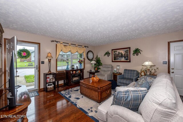 2368 Governors Ct, Maryville, TN 37801 - living area with dark wood-style flooring, a textured ceiling, and baseboards