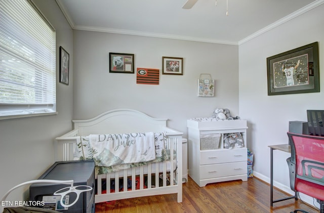 809 Topoca Trl, Athens, TN 37303 - bedroom featuring wood finished floors, ornamental molding, baseboards, a crib, and a ceiling fan