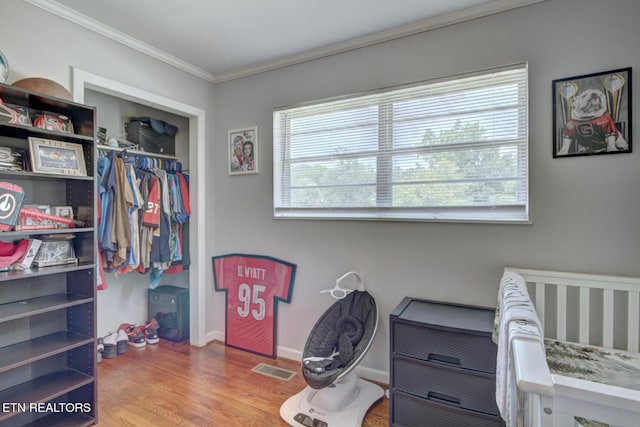 809 Topoca Trl, Athens, TN 37303 - bedroom featuring wood finished floors, ornamental molding, a closet, and baseboards