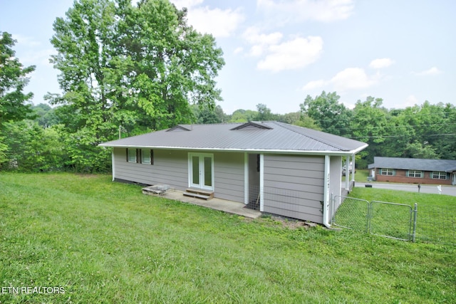 809 Topoca Trl, Athens, TN 37303 - rear view of house featuring metal roof and french doors