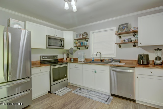 809 Topoca Trl, Athens, TN 37303 - kitchen featuring appliances with stainless steel finishes, open shelves, a sink, white cabinets, and ornamental molding