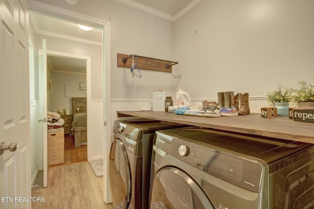 809 Topoca Trl, Athens, TN 37303 - washroom featuring washer and dryer, light wood finished floors, and ornamental molding