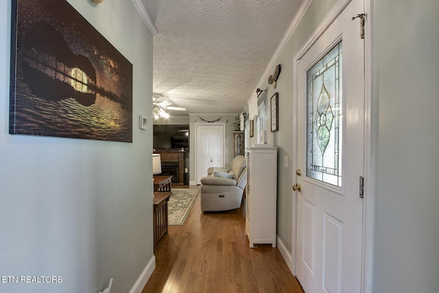 111 Ellis St, Vonore, TN 37885 - hall featuring a textured ceiling, wood finished floors, baseboards, and crown molding
