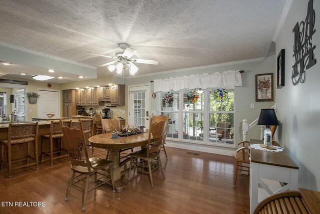 111 Ellis St, Vonore, TN 37885 - dining room featuring wood finished floors, crown molding, a textured ceiling, and a ceiling fan