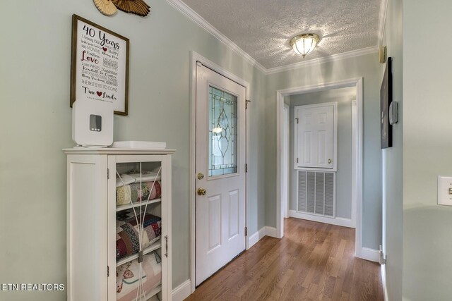 111 Ellis St, Vonore, TN 37885 - entryway featuring wood finished floors, a textured ceiling, crown molding, and baseboards
