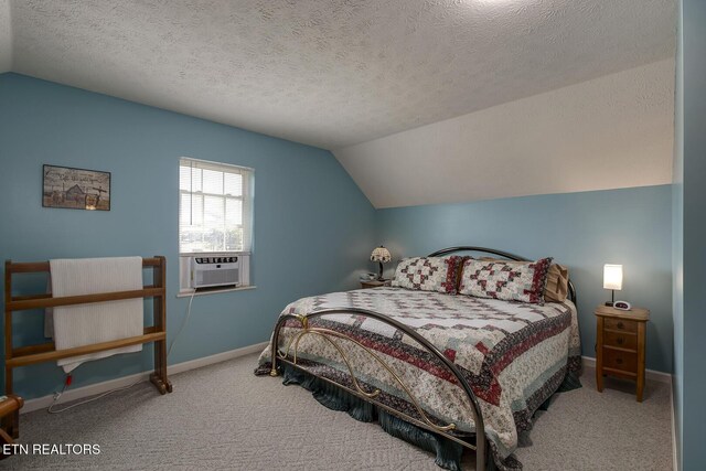 111 Ellis St, Vonore, TN 37885 - bedroom with vaulted ceiling, cooling unit, carpet, baseboards, and a textured ceiling