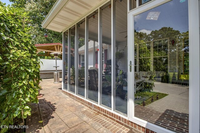 111 Ellis St, Vonore, TN 37885 - view of patio / terrace featuring a sunroom