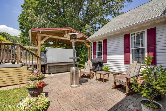111 Ellis St, Vonore, TN 37885 - view of patio / terrace featuring a gazebo, a hot tub, and grilling area
