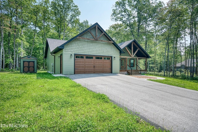 191 Creekview Ct, Jamestown, TN 38556 - view of front of home featuring driveway, a garage, a front yard, and covered porch