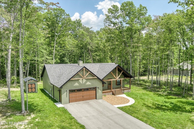 191 Creekview Ct, Jamestown, TN 38556 - view of front facade with driveway, a porch, a front lawn, and an attached garage
