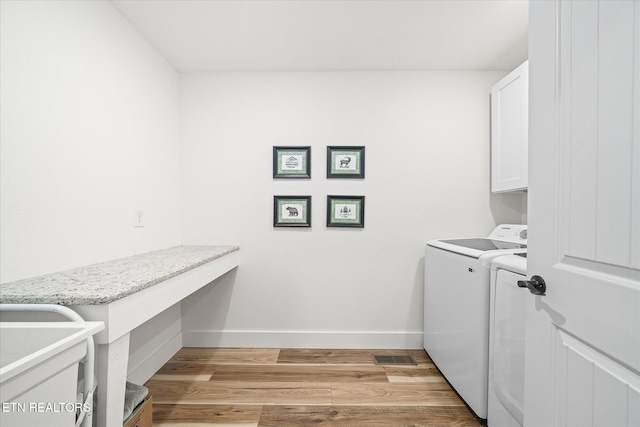 191 Creekview Ct, Jamestown, TN 38556 - laundry area featuring washer and dryer, cabinet space, baseboards, an office area, and light wood-style floors