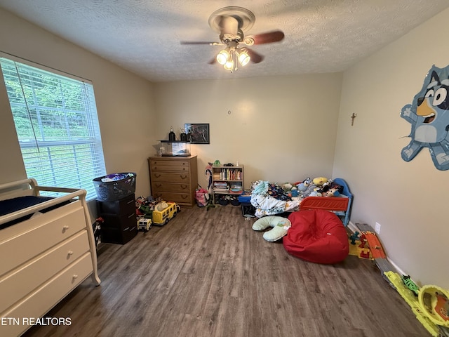 1517 W Copeland Dr, Powell, TN 37849 - bedroom with wood finished floors, a textured ceiling, and a ceiling fan