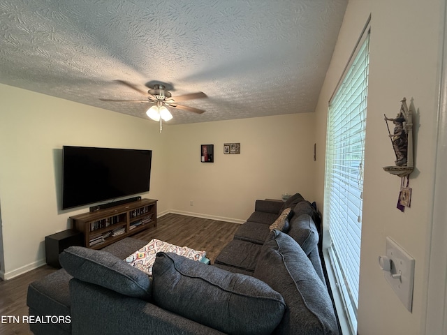 1517 W Copeland Dr, Powell, TN 37849 - living area with ceiling fan, a textured ceiling, dark wood-style flooring, and baseboards
