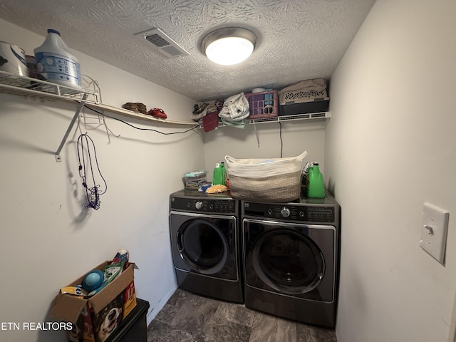 1517 W Copeland Dr, Powell, TN 37849 - laundry room featuring washing machine and dryer and a textured ceiling