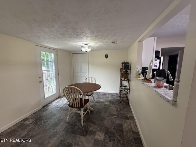 1517 W Copeland Dr, Powell, TN 37849 - dining space featuring baseboards and a textured ceiling