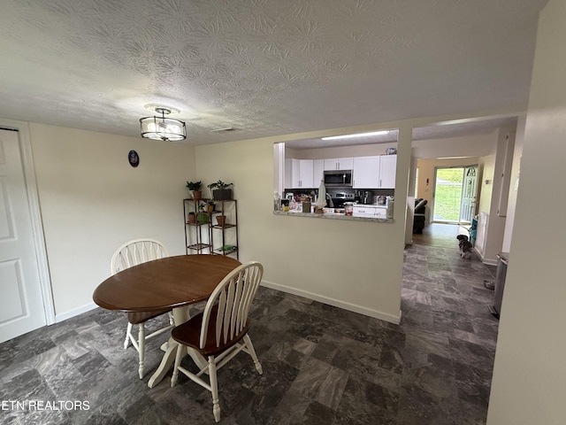 1517 W Copeland Dr, Powell, TN 37849 - dining space with a textured ceiling and baseboards