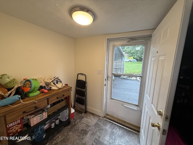 1517 W Copeland Dr, Powell, TN 37849 - doorway to outside featuring baseboards and a textured ceiling