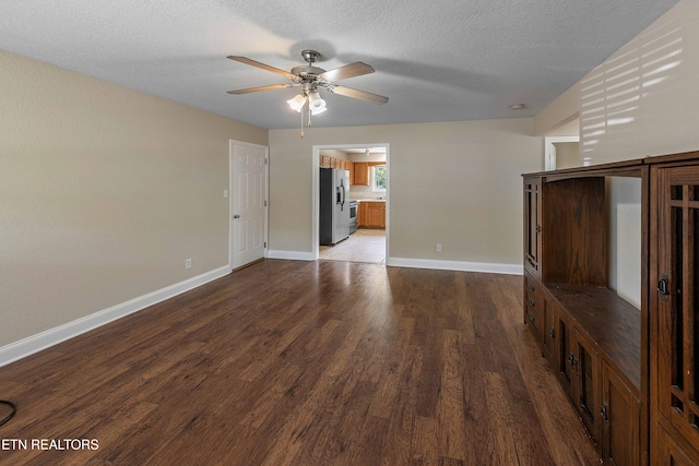 4411 Waldon Pond, Corryton, TN 37721 - unfurnished living room featuring wood finished floors, ceiling fan, baseboards, and a textured ceiling