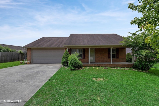 4411 Waldon Pond, Corryton, TN 37721 - single story home featuring brick siding, an attached garage, concrete driveway, covered porch, and roof with shingles