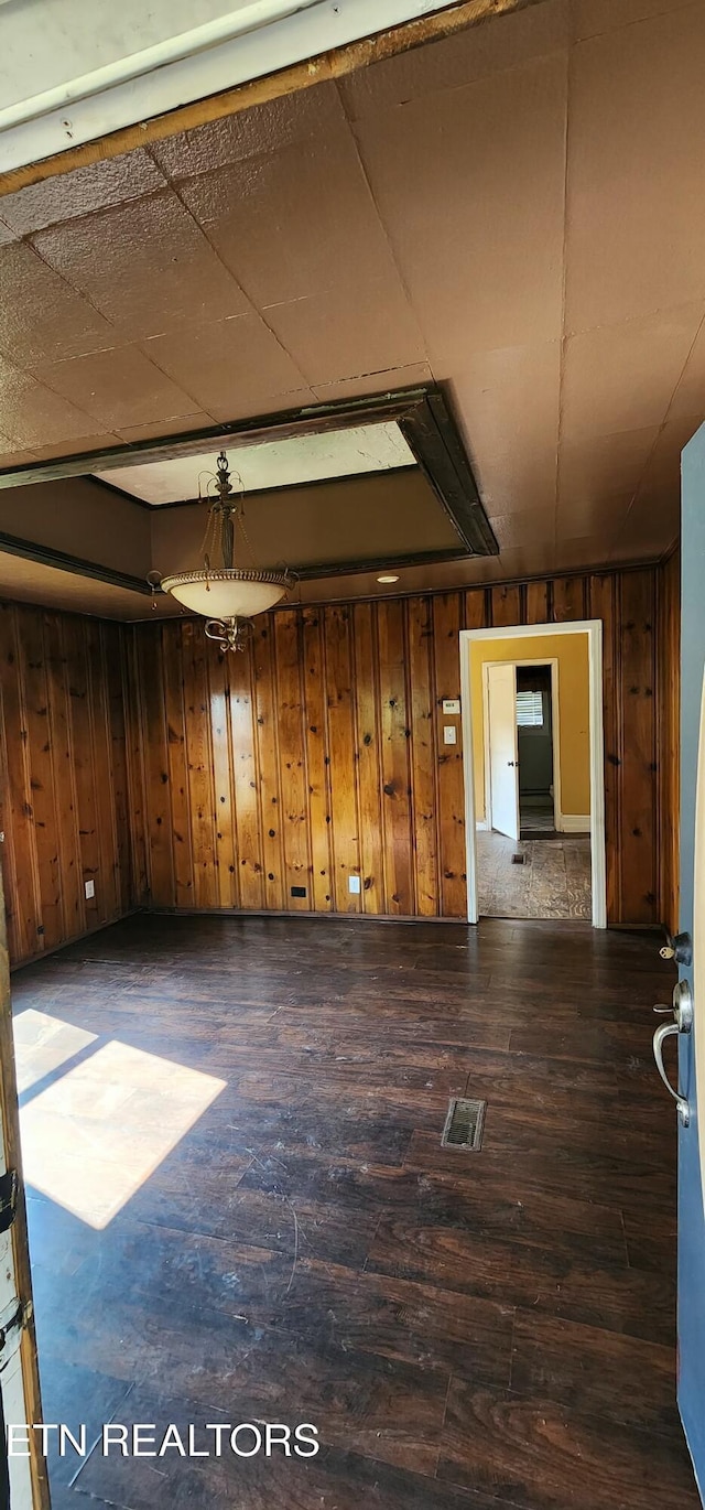 378 Church St, Jellico, TN 37762 - unfurnished room featuring wooden walls and hardwood / wood-style floors