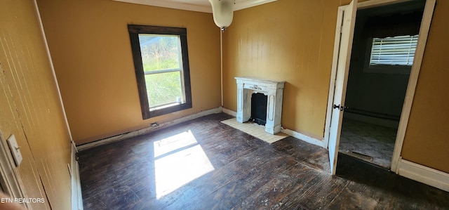 378 Church St, Jellico, TN 37762 - unfurnished living room with wood-type flooring, a fireplace with flush hearth, and ornamental molding