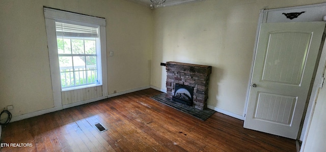 378 Church St, Jellico, TN 37762 - unfurnished living room featuring hardwood / wood-style floors and a stone fireplace