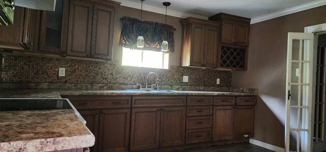 378 Church St, Jellico, TN 37762 - kitchen featuring decorative backsplash, crown molding, and decorative light fixtures