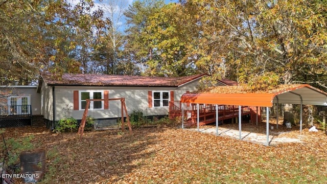 1477 Womac Hollow Rd, Ten Mile, TN 37880 - back of house featuring a wooden deck and a detached carport