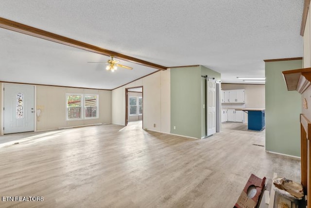 1477 Womac Hollow Rd, Ten Mile, TN 37880 - unfurnished living room with light wood finished floors, a ceiling fan, a textured ceiling, and baseboards
