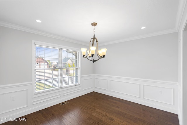 6305 Glen Eagle Ln, Knoxville, TN 37921 - empty room with healthy amount of natural light, a chandelier, wainscoting, dark wood-type flooring, and crown molding