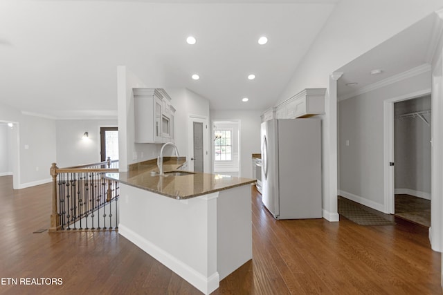 6305 Glen Eagle Ln, Knoxville, TN 37921 - kitchen with freestanding refrigerator, a sink, dark stone countertops, dark wood-style floors, and crown molding