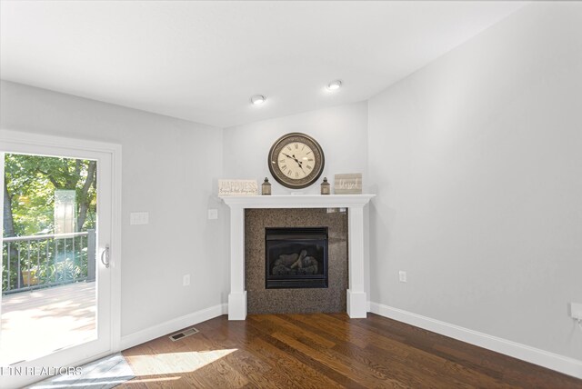 6305 Glen Eagle Ln, Knoxville, TN 37921 - unfurnished living room with dark wood finished floors, a glass covered fireplace, and baseboards