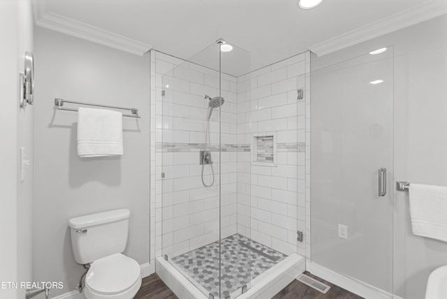 6305 Glen Eagle Ln, Knoxville, TN 37921 - full bath featuring crown molding, toilet, baseboards, a shower stall, and wood finished floors