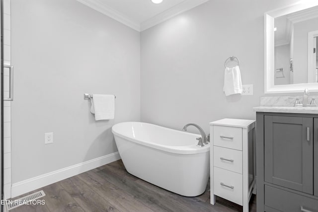 6305 Glen Eagle Ln, Knoxville, TN 37921 - full bath featuring vanity, a soaking tub, crown molding, wood finished floors, and baseboards