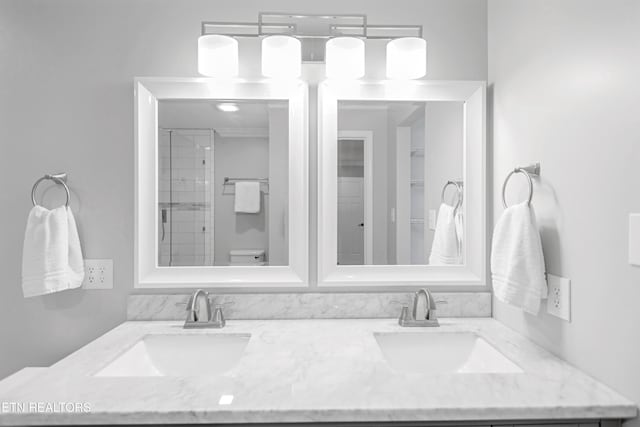 6305 Glen Eagle Ln, Knoxville, TN 37921 - bathroom featuring double vanity, toilet, and a shower