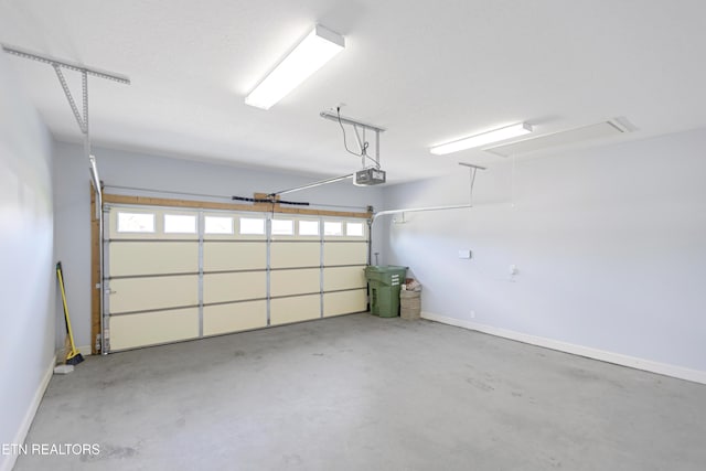 6305 Glen Eagle Ln, Knoxville, TN 37921 - garage featuring a garage door opener and baseboards
