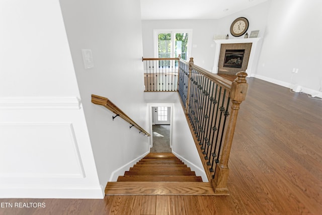 6305 Glen Eagle Ln, Knoxville, TN 37921 - stairway featuring wood finished floors, baseboards, and a glass covered fireplace