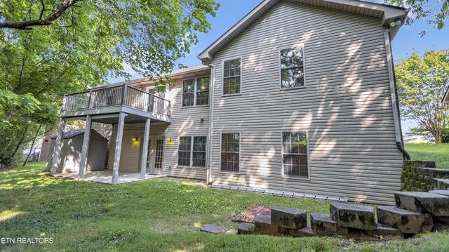 6305 Glen Eagle Ln, Knoxville, TN 37921 - back of house featuring a lawn, a patio area, and a wooden deck