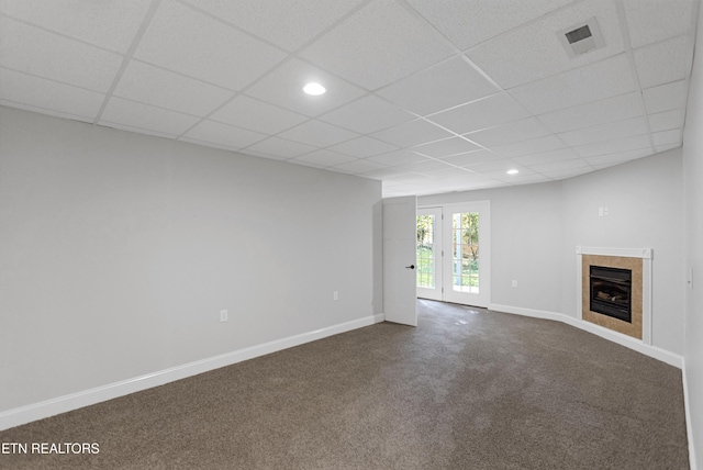 6305 Glen Eagle Ln, Knoxville, TN 37921 - unfurnished living room with baseboards, dark colored carpet, a paneled ceiling, a tile fireplace, and recessed lighting