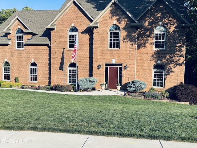 12912 Long Ridge Rd, Knoxville, TN 37934 - view of front of house featuring a front lawn, brick siding, and a shingled roof