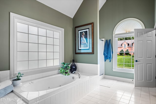 12912 Long Ridge Rd, Knoxville, TN 37934 - bathroom featuring vaulted ceiling, a jetted tub, baseboards, and tile patterned floors