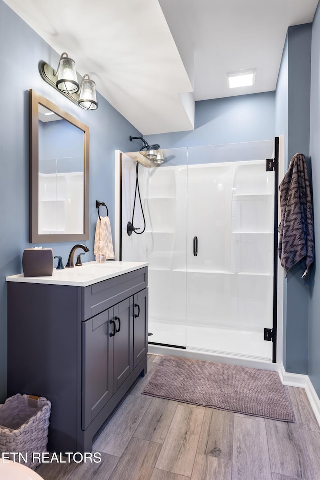 12912 Long Ridge Rd, Knoxville, TN 37934 - bathroom featuring wood finished floors, vanity, and a stall shower