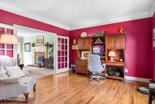 12912 Long Ridge Rd, Knoxville, TN 37934 - home office featuring crown molding, a brick fireplace, light wood-style flooring, baseboards, and french doors