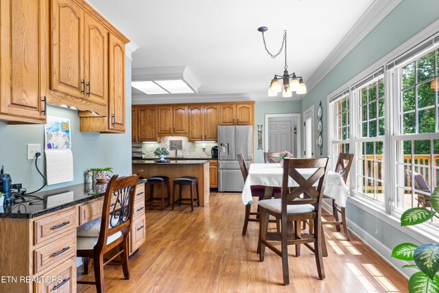 12912 Long Ridge Rd, Knoxville, TN 37934 - kitchen featuring stainless steel refrigerator with ice dispenser, ornamental molding, light wood finished floors, a chandelier, and decorative light fixtures