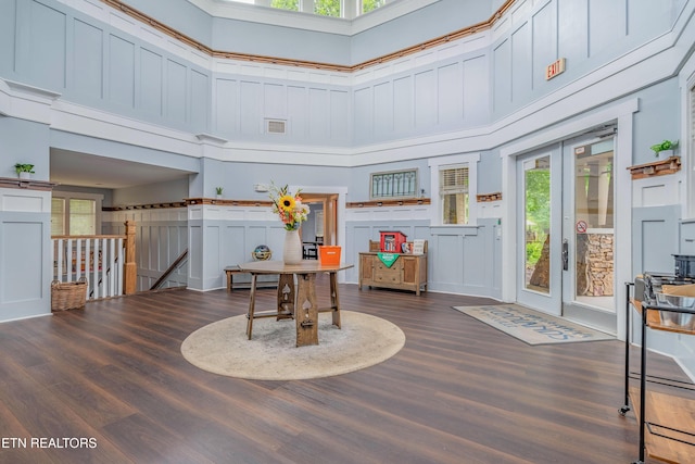 3950 Cherokee Woods Way Unit 105, Knoxville, TN 37920 - living area with french doors, a towering ceiling, wood finished floors, and an upstairs landing
