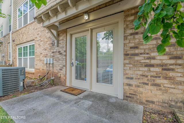 3950 Cherokee Woods Way Unit 105, Knoxville, TN 37920 - entrance to property featuring central AC, a patio, and brick siding