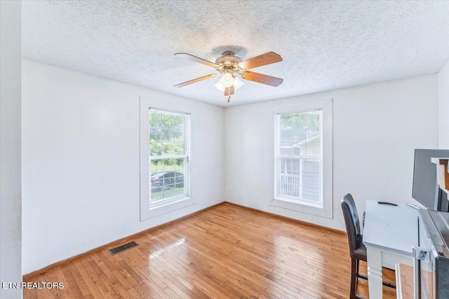 613 Victory St, Knoxville, TN 37919 - unfurnished office with hardwood / wood-style floors, ceiling fan, and a textured ceiling