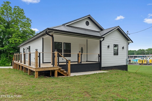 901 Apple St, Athens, TN 37303 - back of property featuring a lawn, crawl space, a wooden deck, and metal roof