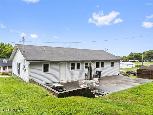 321 Sunrise Dr, Kingston, TN 37763 - back of property with a lawn and a shingled roof