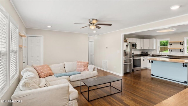321 Sunrise Dr, Kingston, TN 37763 - living area with a ceiling fan, dark wood-style flooring, recessed lighting, baseboards, and crown molding